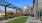 Courtyard at our apartments in Darien, featuring astroturf, outdoor seating, and a view of the apartment complex.