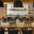 Long table with ample seating, communal kitchen and breakfast bar seating