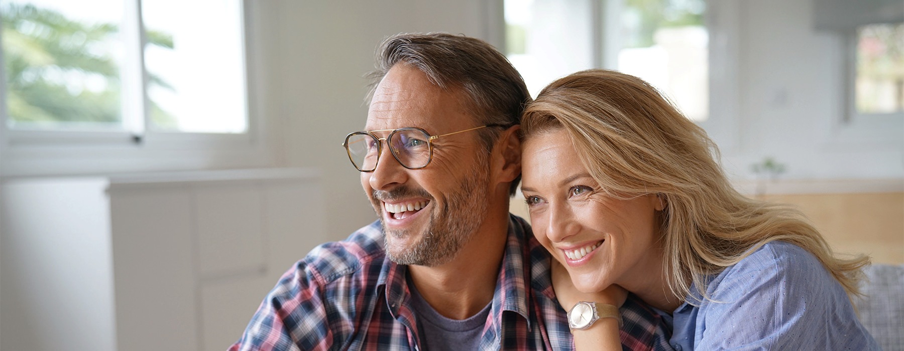 A couple sitting together smiling